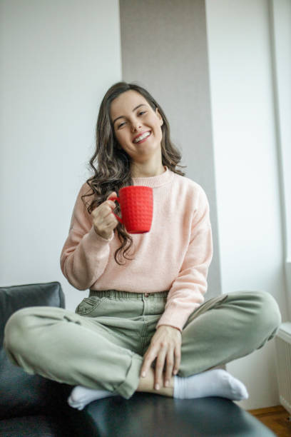istock Woman enjoying in coffee at home 1298125530