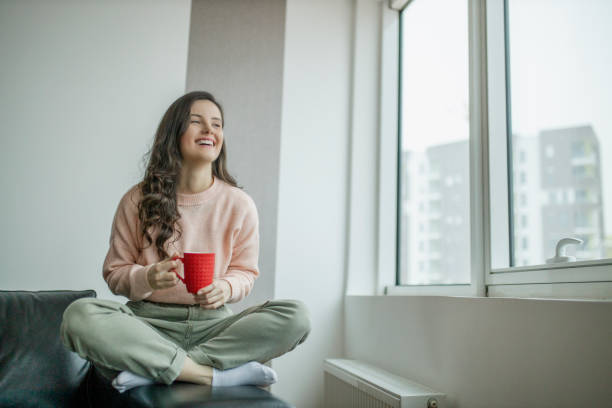 istock Woman enjoying in coffee at home 1298125636