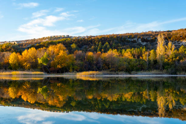 istock Autumn reflections in a lake 1298125677