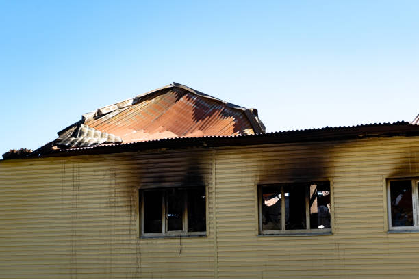 istock Burnt shop with a charred wall and broken windows. The consequences of a fire 1298127584