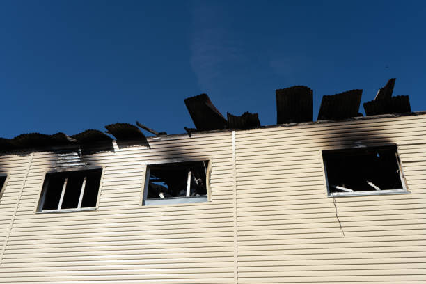 istock Burnt shop with a charred wall and broken windows. The consequences of a fire 1298128120