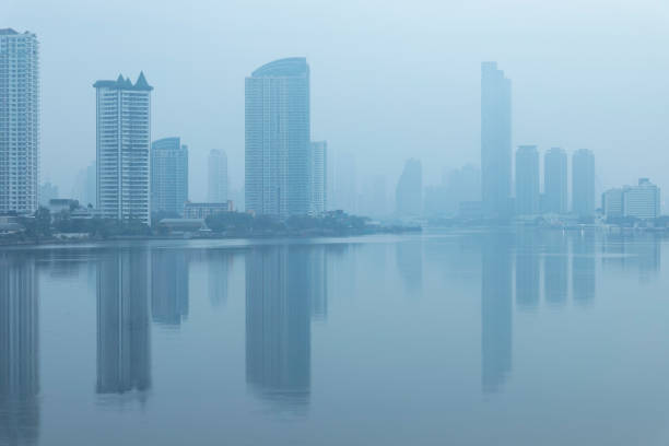Bangkok office buildings and condominium with Chao Phraya river and chips. Office building under smog in Sathorn Bangkok. Smog PM 2.5 is a kind of air pollution. Bangkok City in the air pollution.