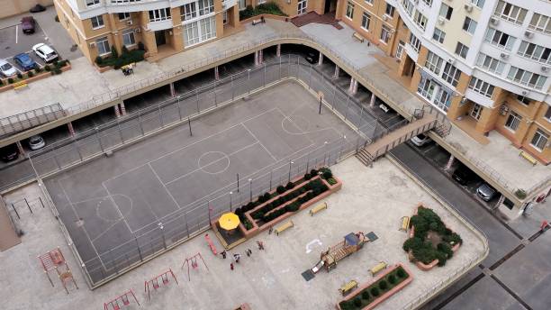 Aerial view of kids and sport playgrounds between condo buildings stock photo