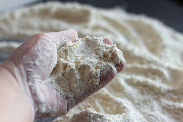 istock Flour in your hand and on the table while cooking. 1298137854