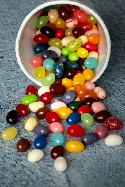 istock Jelly beans spilling from white foam cup 1298138379