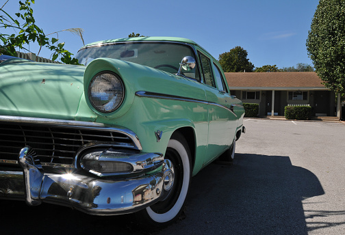 Springfield, MO, USA, Oct. 4, 2019: A classic Ford automobile parked at the Best Western Route 66 Rail Haven hotel in Springfield, Missouri. The Rail Haven Motor Court opened on Route 66 in 1938.