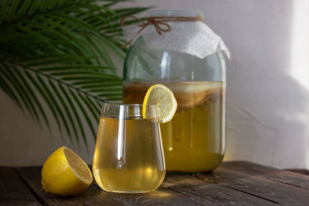 istock Fermented Kombucha drink in a glass glass. Selective focus, place for text. 1298139150