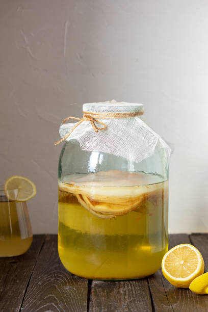 istock Fermented Kombucha drink in a glass jar. Selective focus, place for text. 1298139209