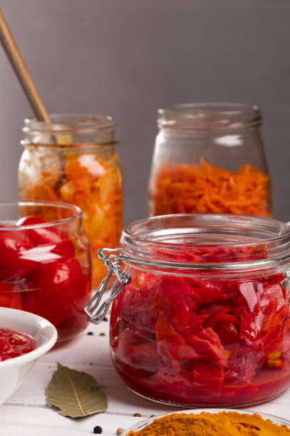 istock Home cooking fermented vegetables in jars and plates close-up 1298140663