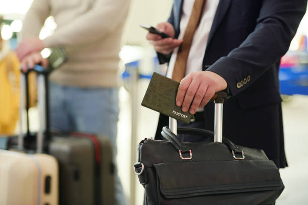 istock Man with documents at airport 1298142240