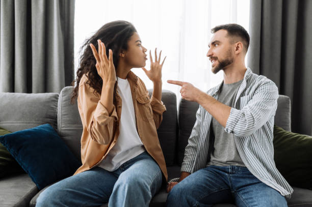 istock Married young couple emotional discuss about something, they having problem. African american woman and caucasian man disagree with each other have a misunderstanding, cant make decision, a quarrel between lovers 1298143162
