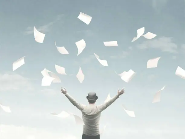 Photo of illustration of man throwing sheets of paper in the air, surreal concept