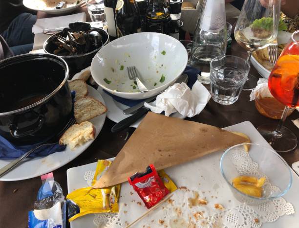 istock after dinner lunch empty eaten plates pots boards - messy not tidy and cleared table 1298144891