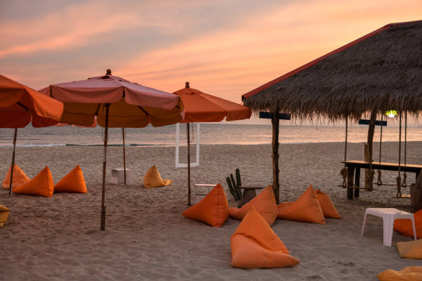 istock beanbag seats on beach at dusk with twilight sky 1298147665