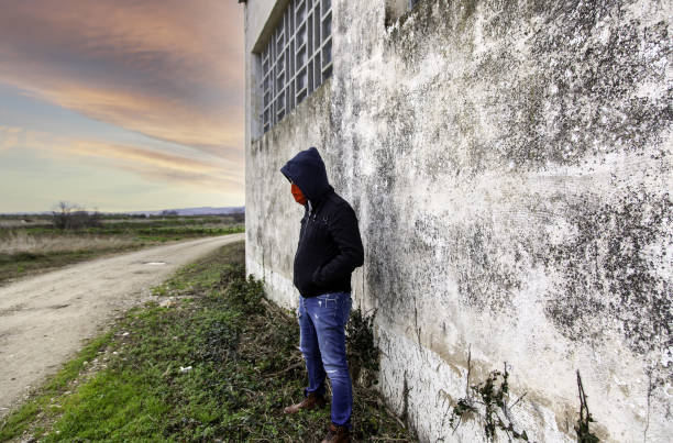 istock Young street gang with mask 1298148320