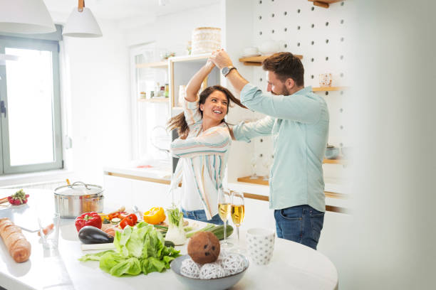 istock Romantic young couple dancing in kitchen spinning 1298149756