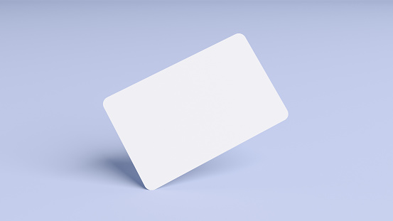 Blank credit card mockup floating over a blue background in realistic 3D rendering. Rounded corners business card mock up for design template