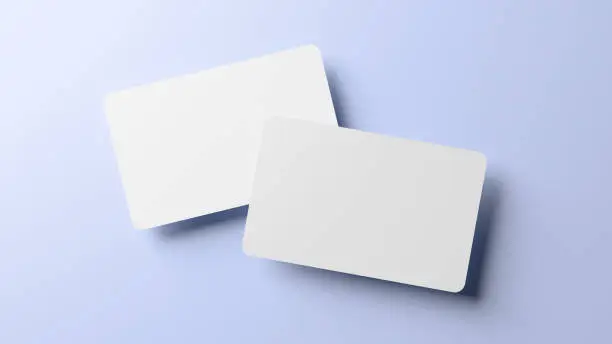 Photo of Rounded corners business cards mock up for design template. Blank credit card mockup front and back on blue background in realistic 3D rendering