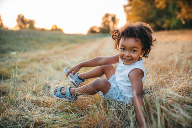 istock Little boy lying in the grass 1298151159