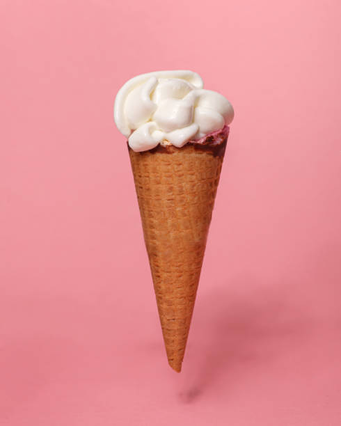 istock ice cream waffle cone isolated on pink background 1298151357