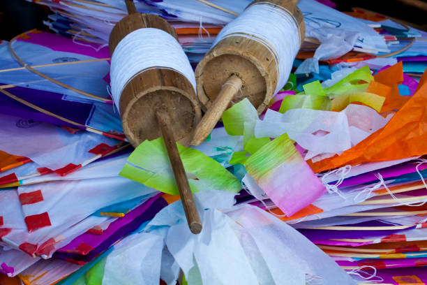 istock Colored paper kites and latai (Knitting reel). 1298152679