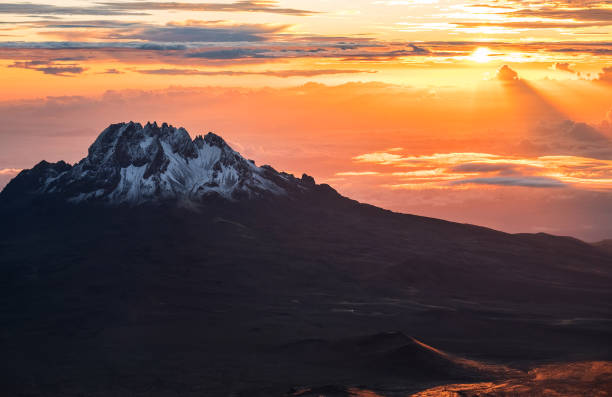 Breathtaking view of sunrise morning sky with Mawenzi mountain peak 5148m - the 4th highest peak in Africa. Kilimanjaro National Park, Tanzania. Breathtaking view of sunrise morning sky with Mawenzi mountain peak 5148m - the 4th highest peak in Africa. Kilimanjaro National Park, Tanzania. mawenzi stock pictures, royalty-free photos & images