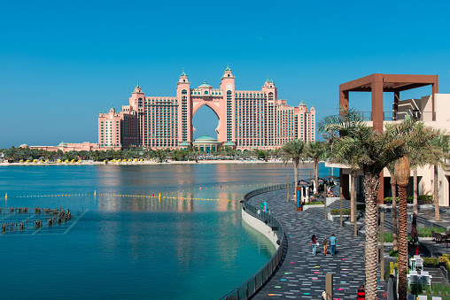 Dubai, United Arab Emirates - December 1, 2020: The Pointe dining and leisure area at Palm Jumeirah island overlooking the Atlantis hotel in Dubai on a blue sky morning in the UAE