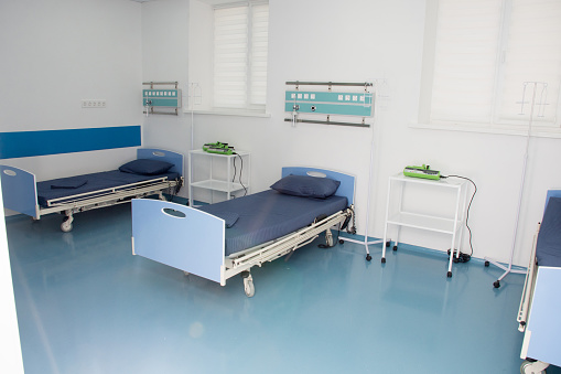 Empty modern hospital room for several patients. Modern medical equipment in the intensive care unit
