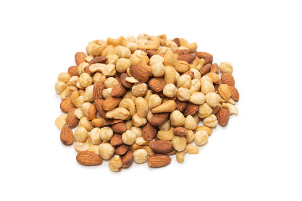 istock Mix of nuts isolated on white background. Top view. 1298158611