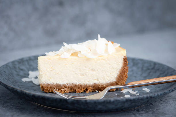 istock Slice of coconut cheesecake 1298159788