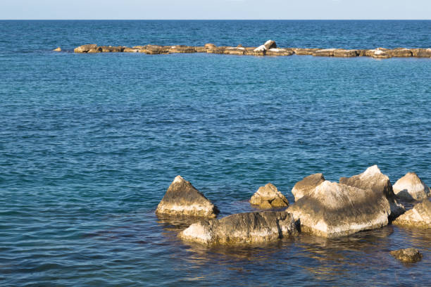 istock The seascape. White stones in the foreground 1298163636