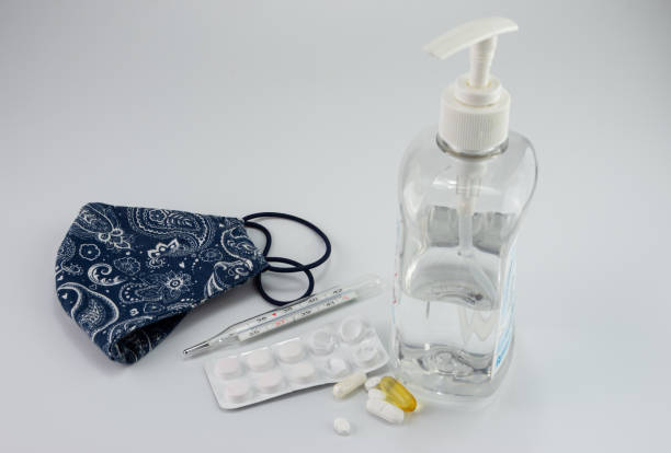 istock Medical thermometer, face mask, tablets COVID - 19 Coronavirus, disinfectant , 1298166536