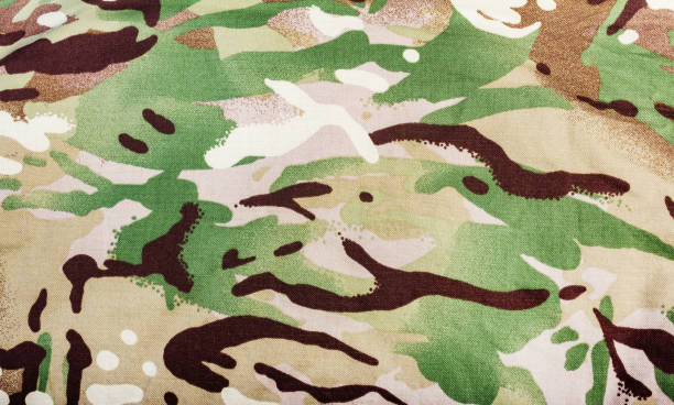istock Military multicolored camouflage cloth texture close-up. 1298167297