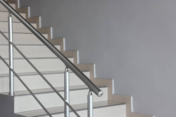 Stairs in the building with metal handrail View of Aluminium Stair Railing and Joint Element baluster stock pictures, royalty-free photos & images