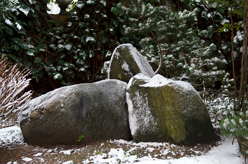 Stones under the snow. Interesting winter background.