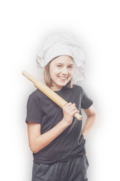 istock A young, female chef in a traditional hat and coat. 1298170271