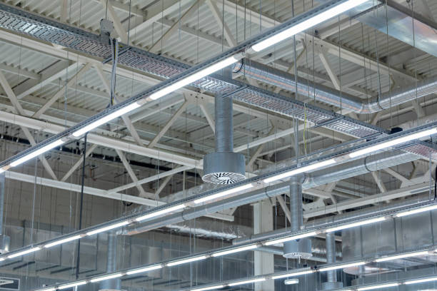 istock Lamps with diode lighting and ventilation under the ceiling of a modern warehouse or shopping center. Ceiling air conditioning of the stadium or exhibition hall roof. 1298171092