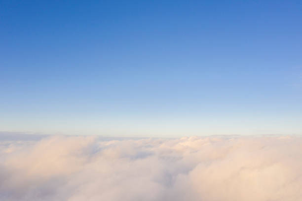istock Aerial view white clouds in blue sky. Aerial top view cloudscape. Texture of clouds. View from above. Clouds texture background. Panorama clouds texture 1298172800