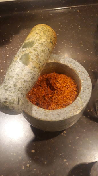 istock powdered seasoning in the stone made mortar 1298175024
