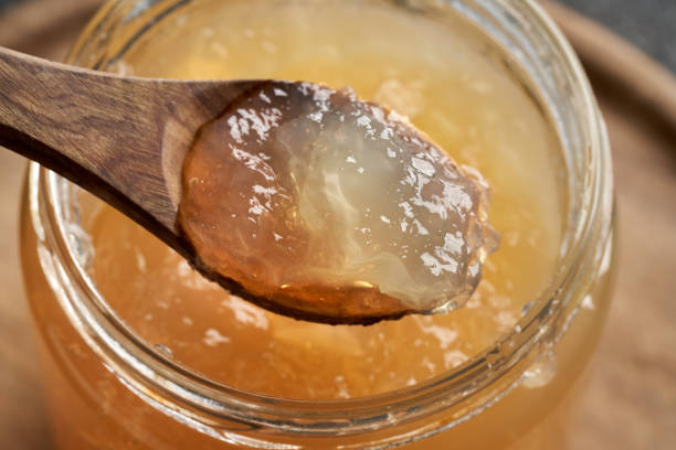 istock Chilled congealed beef bone broth on a wooden spoon 1298176530