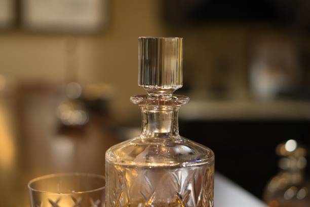 istock Whiskey in crystal decanter and crystal glasses for celebration 1298176756