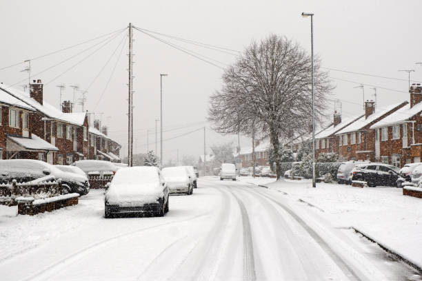 istock Typical UK street in winter snow 1298178761