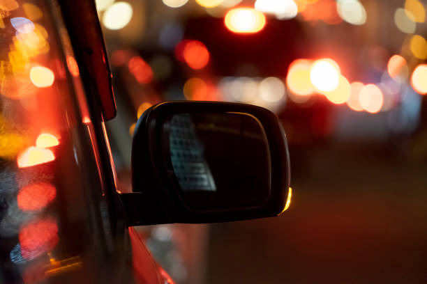 istock Car mirror on the background of the night 1298179931