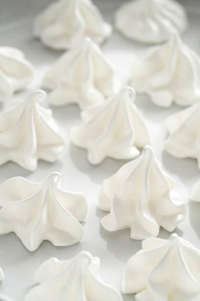 istock Meringue kisses in white homemade with egg white on white 1298180042