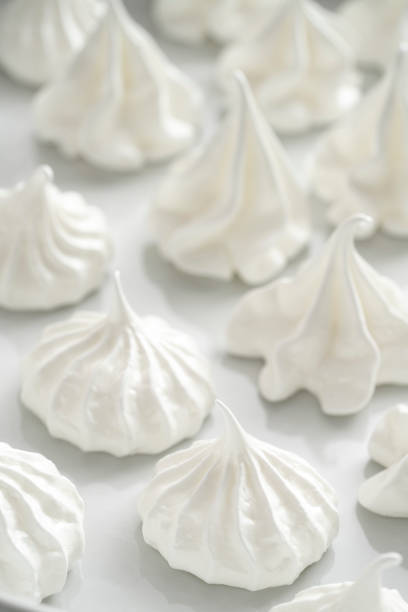 istock Meringue kisses in white homemade with egg white on white 1298180164
