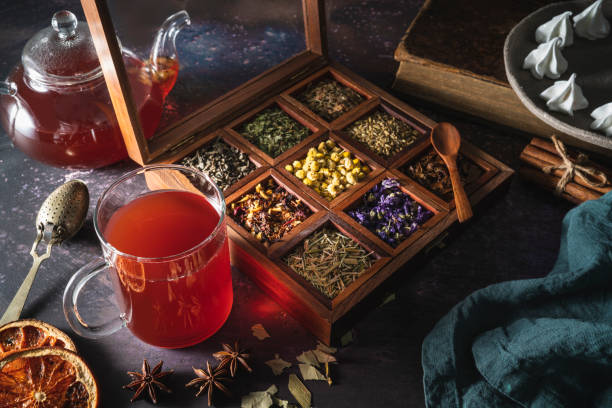 istock Red tea with a box of tea herbs and aromatic spices 1298180249