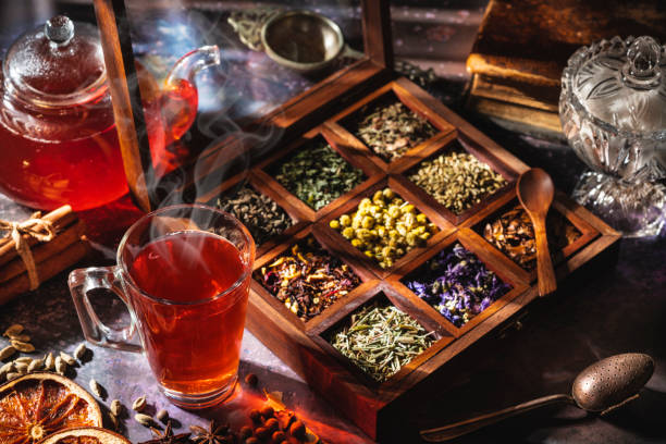 istock Red tea with a box of tea herbs and aromatic spices 1298180899