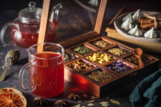 istock Red tea with a box of tea herbs and aromatic spices 1298181041