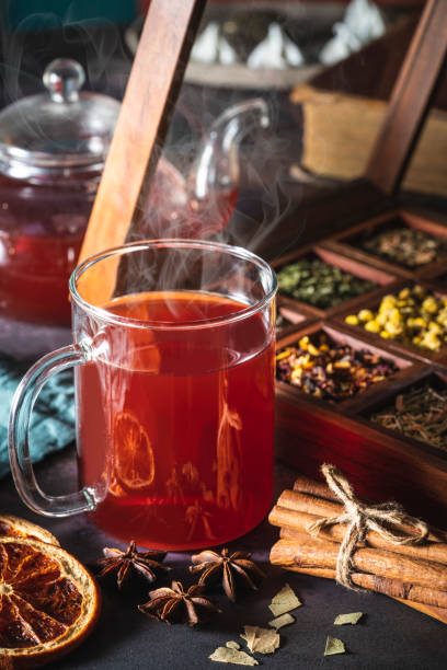 istock Red tea with a box of tea herbs and aromatic spices 1298181126