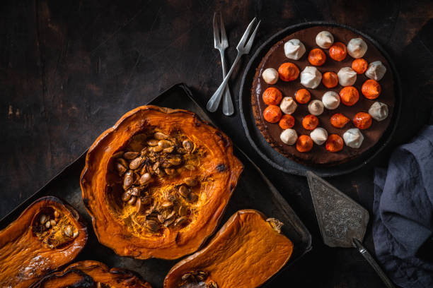 istock Pumpkin and chocolate cake with roasted butternut squash and pumpkin in a tray 1298182062